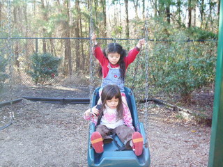 a&k on baby swing.jpg